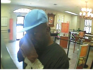 SEARCH FOR BANK SUSPECT EXPANDS