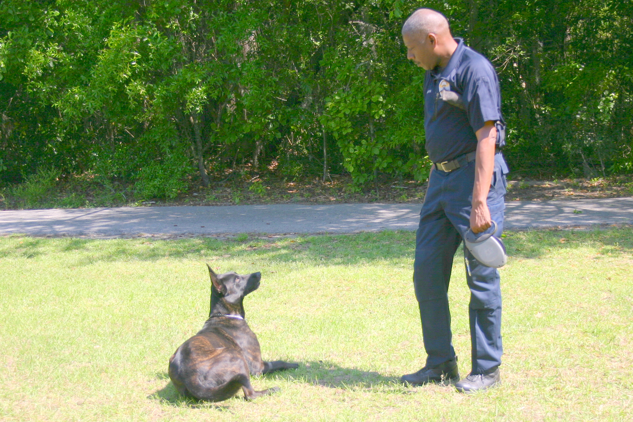 Ziggy signals to his partner Ofc. Mike Drayton that he has found a shell casing.